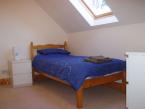The single bedroom is spacious and airy