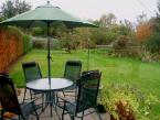 The chalet has a garden with a patio that is perfect for relaxing