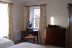 The top floor has two twin attic bedrooms and a shower room with WC