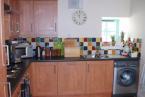 The welcoming kitchen is fully equipped with electric oven and hob, microwave, dishwasher, fridge freezer and washing machine.