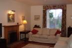 On the ground floor is a large entrance porch and utility / boot room, elegant sitting room with feature gas fire and polished wood flooring