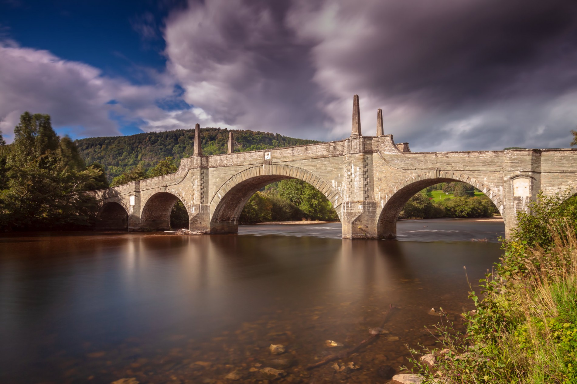 Wades Bridge, Aberfeldy Wades Bridge spanning the gentle flowing River Tay, against the backdrop of a darkening sky