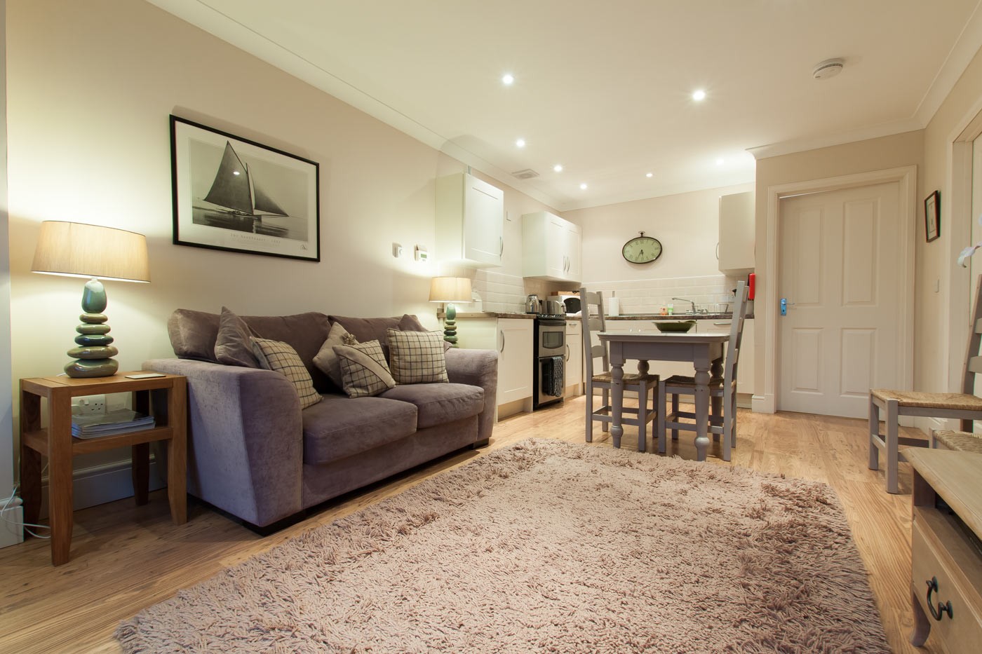 kitchen/ living/ dining room with sofa, dining table and oven