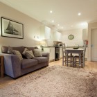 kitchen/ living/ dining room with sofa, dining table and oven