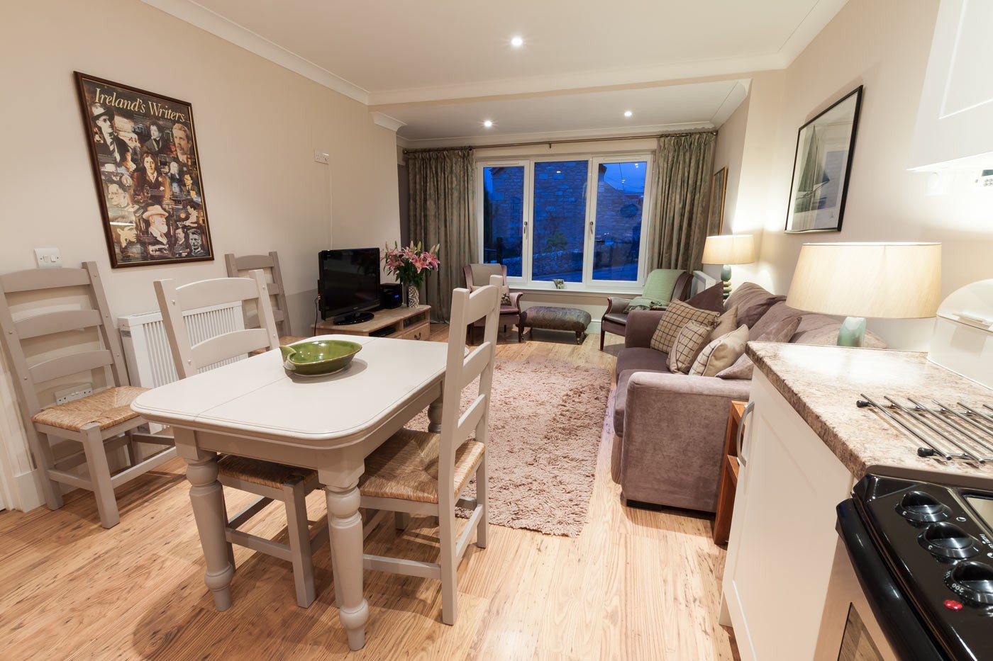 Dining room table and chairs and sofas.