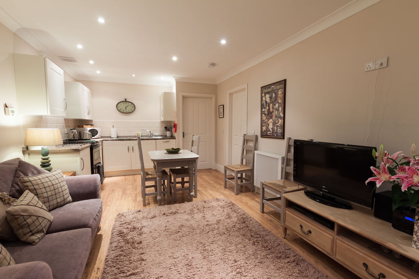 Open plan living room, dining room and kitchen.