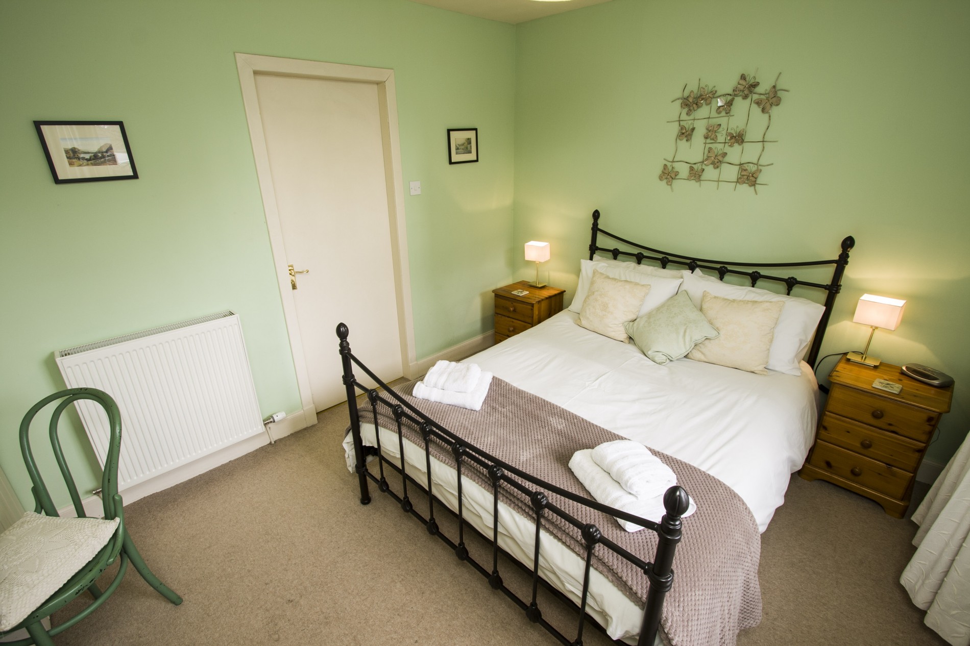 Double bedroom with bedside tables either sides.