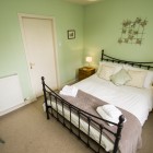 Double bedroom with bedside tables either sides.
