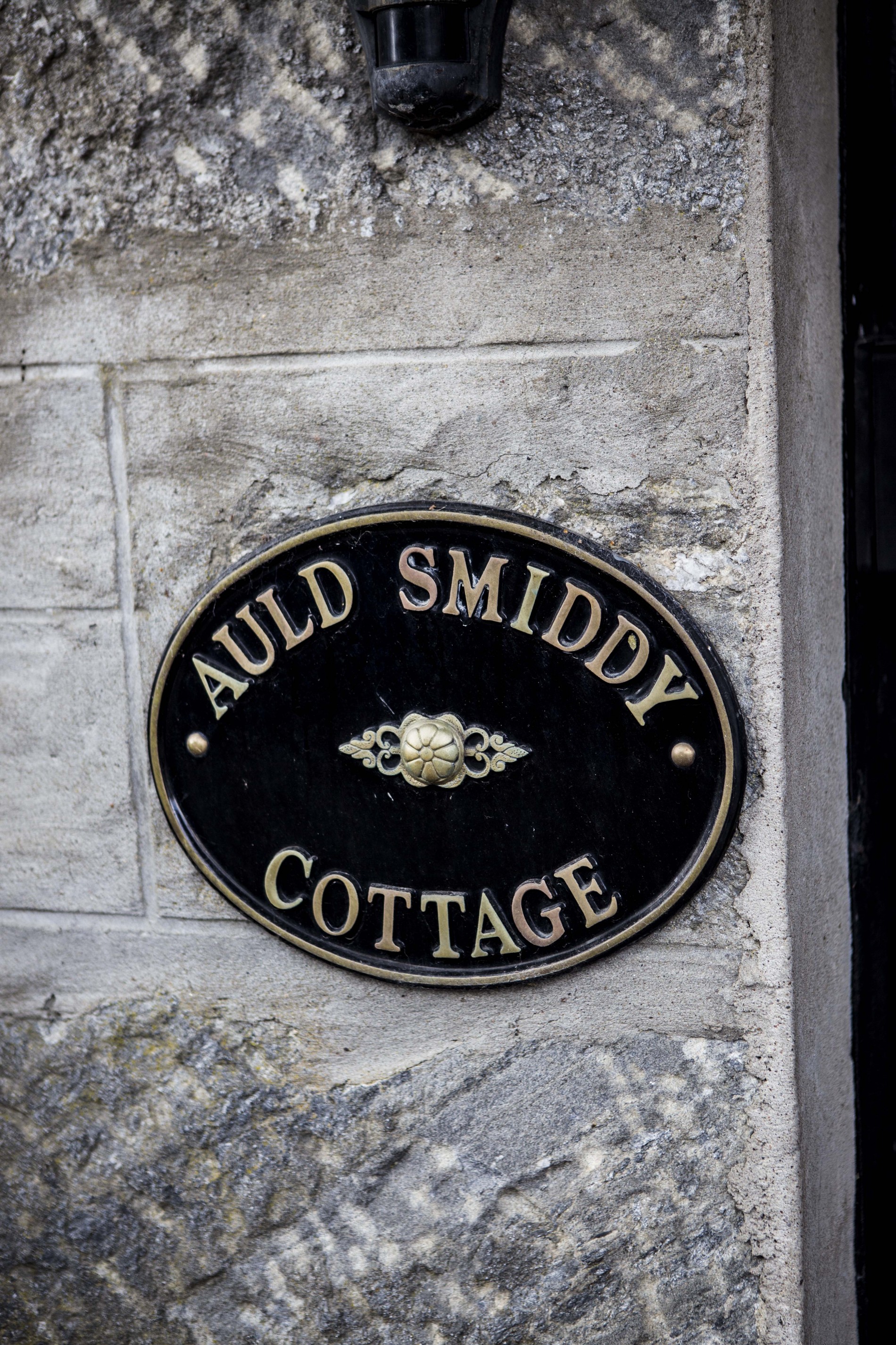 Auld Smiddy Cottage sign.
