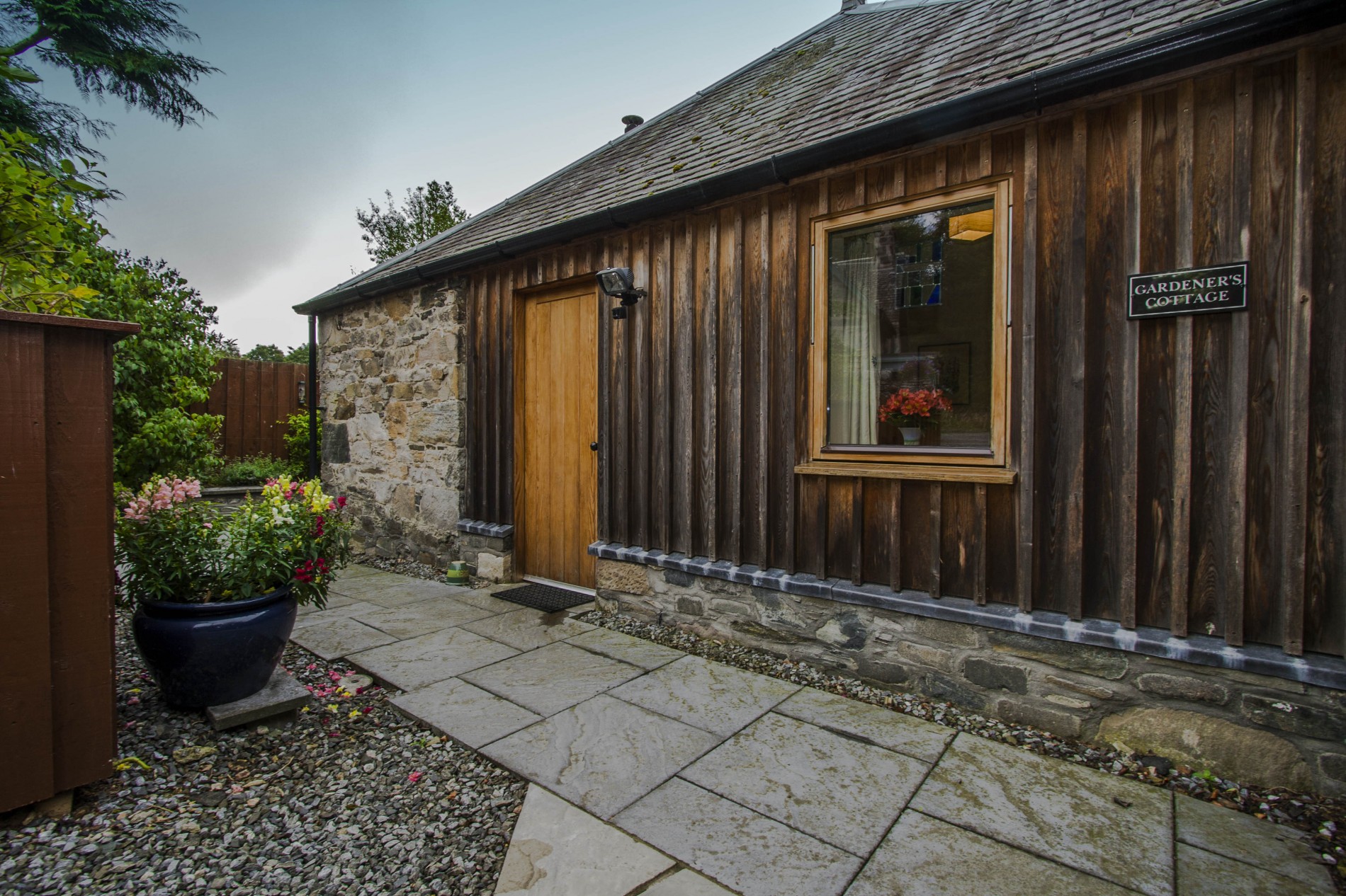 Entrance to cottage, parking for one car on driveway