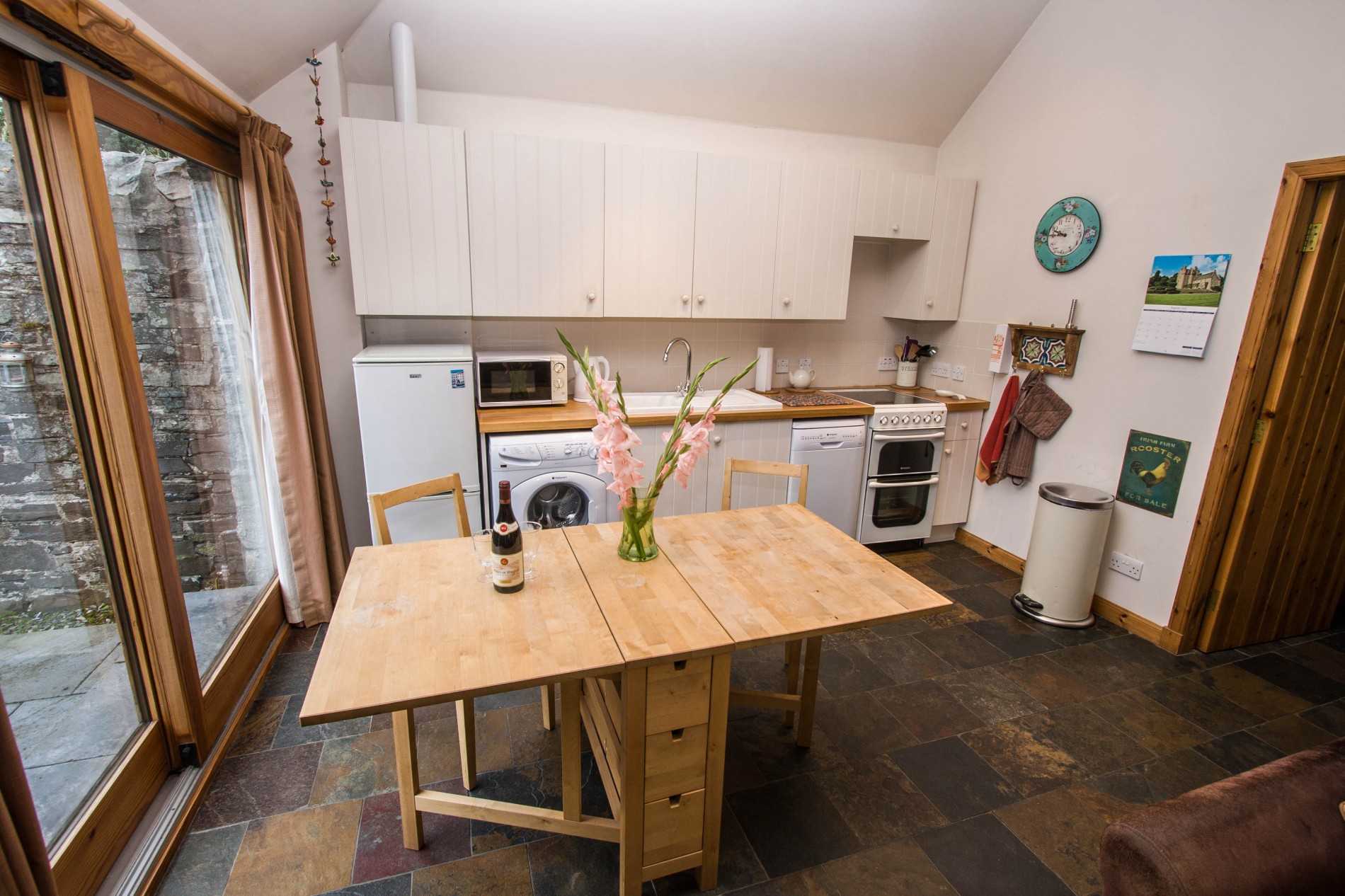 Well equipped kitchen and dining area, washing machine, microwave, dishwasher, fridge, freezer