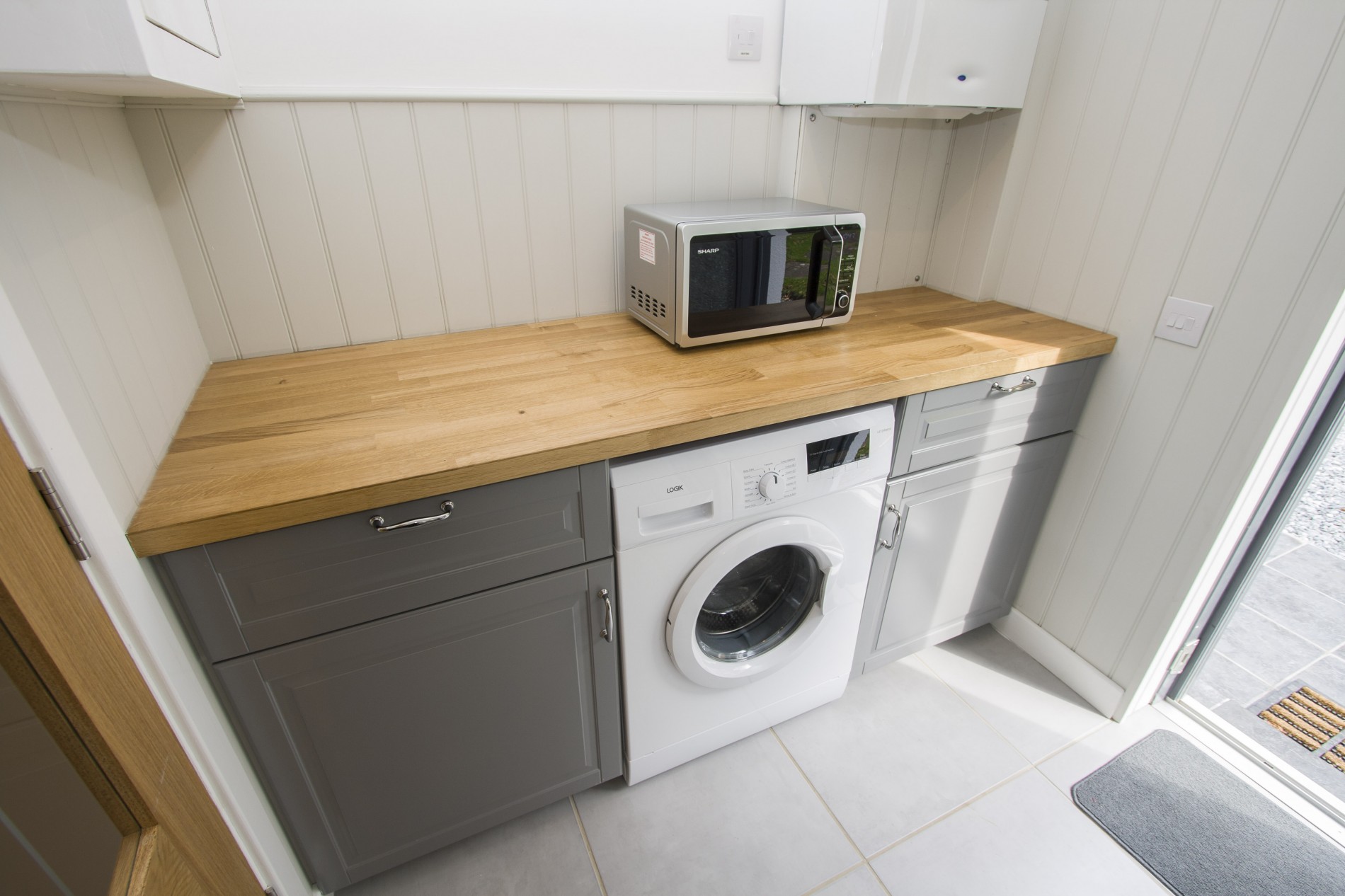 Washing machine and microwave in utility area