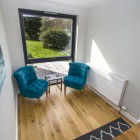 Seating area beside large window to enjoy the beautiful views