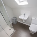 Master bedroom ensuite featuring shower cubical, WC, and wash hand basin