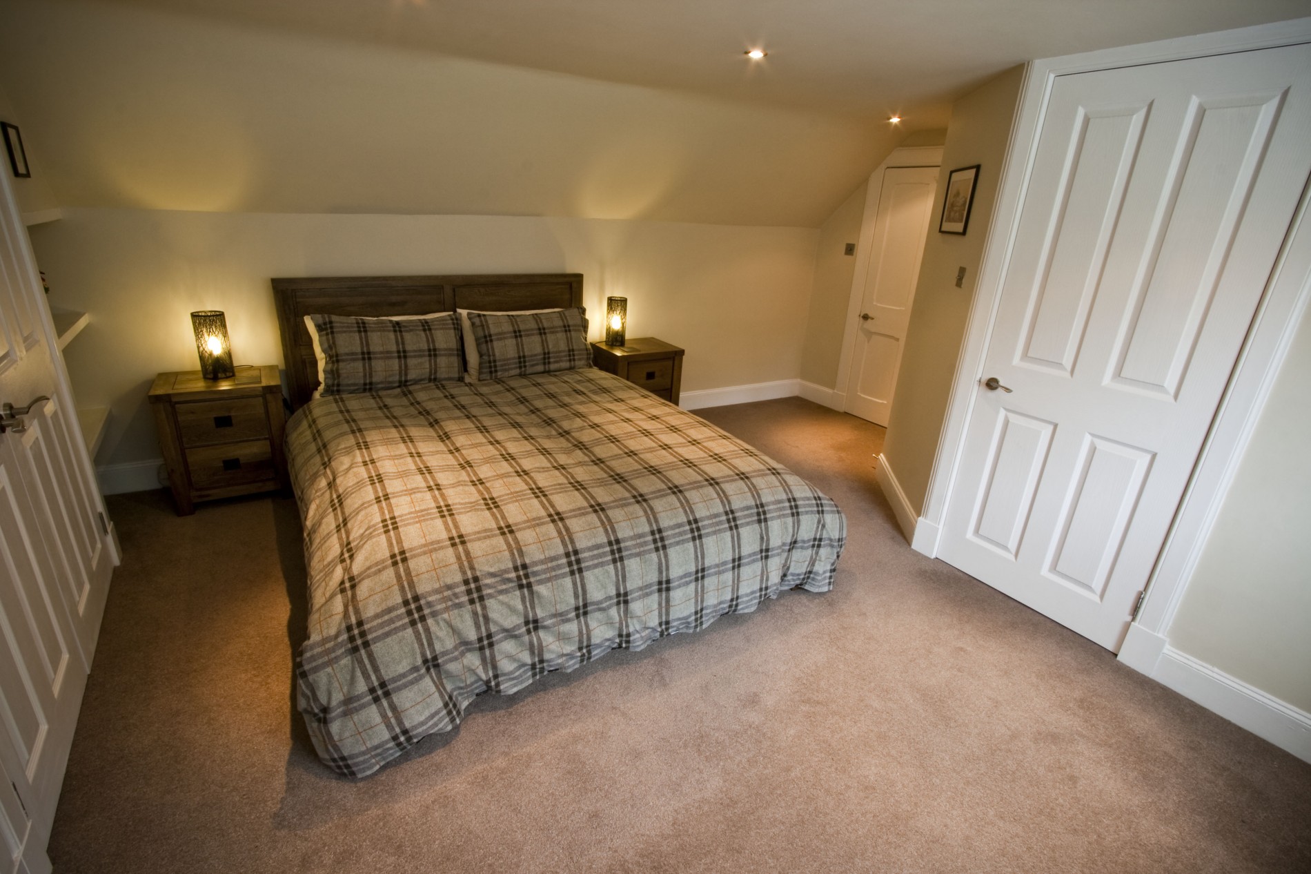 The attractive double bedroom has built in wardrobes offering excellent hanging and storage space, also a double sofa bed