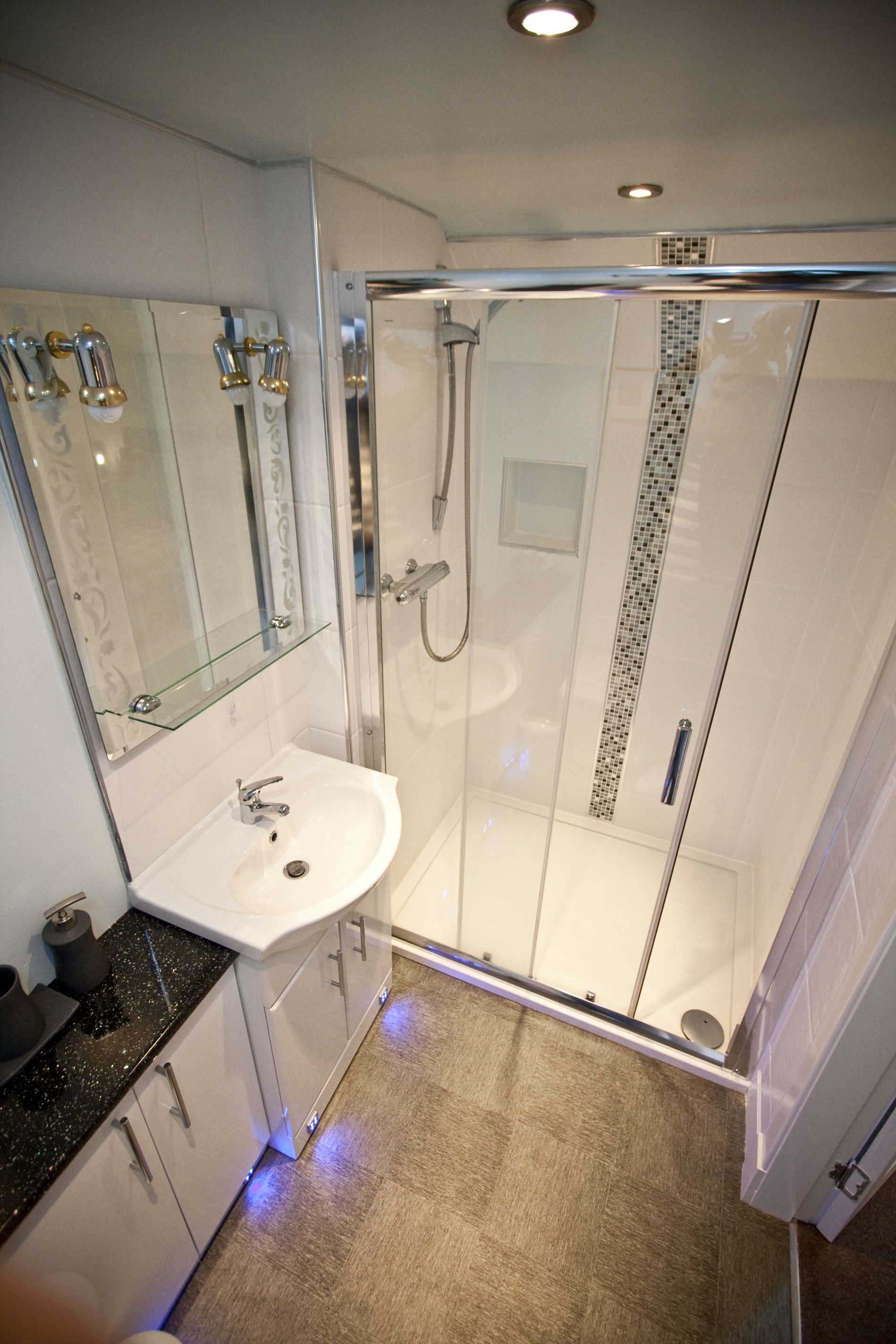 The modern en-suite is fitted with WC, wash hand basin and large walk in shower cubicle.