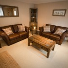 Large, comfortable living room with newly installed wood burning stove, feature stone wall and Caithness stone hearth.LED TV, DVD player and Freeview box.