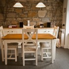 The separate dining area has a beautiful exposed stone wall and table seating four.DAB radio and MP3 Player. Rear door leading to parking area and cottage garden beyond.