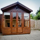 The large patio area with garden furniture enjoys lovely views of the surrounding hills while the summer house is perfect for alfresco dining and relaxing