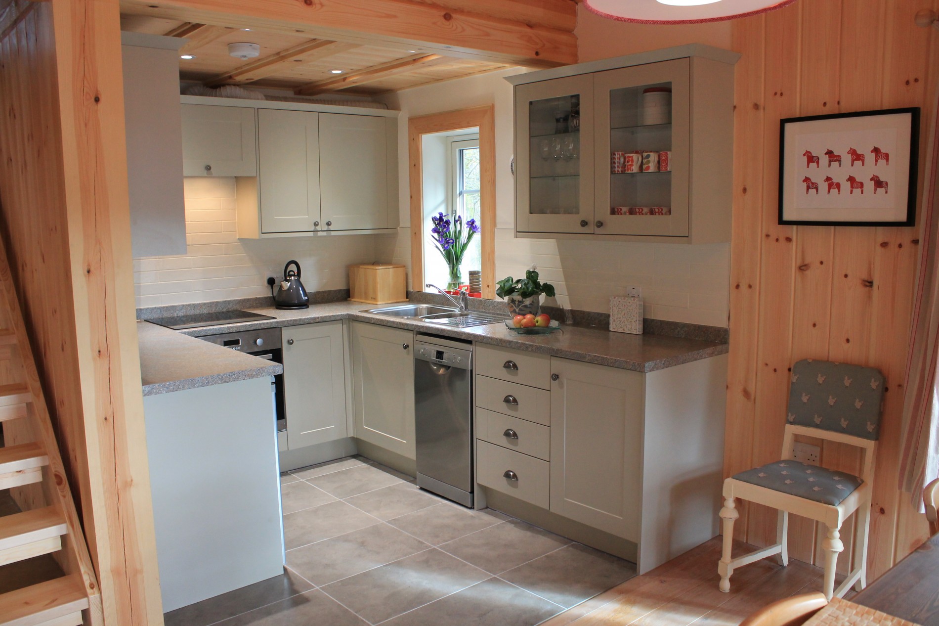 Kitchen with oven, cabinets and dishwasher
