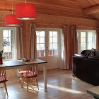 Living/dining room with windows and door to patio