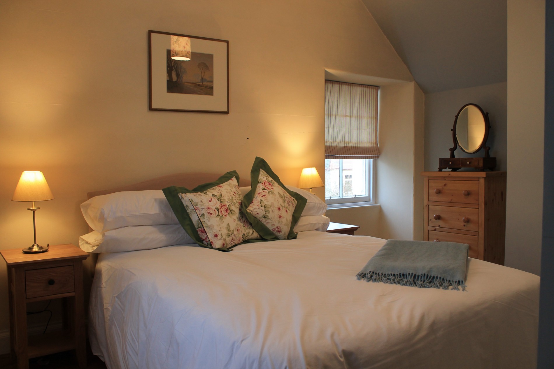 Double bedroom with bedside tables and chest of drawers