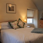 Double bedroom with bedside tables and chest of drawers