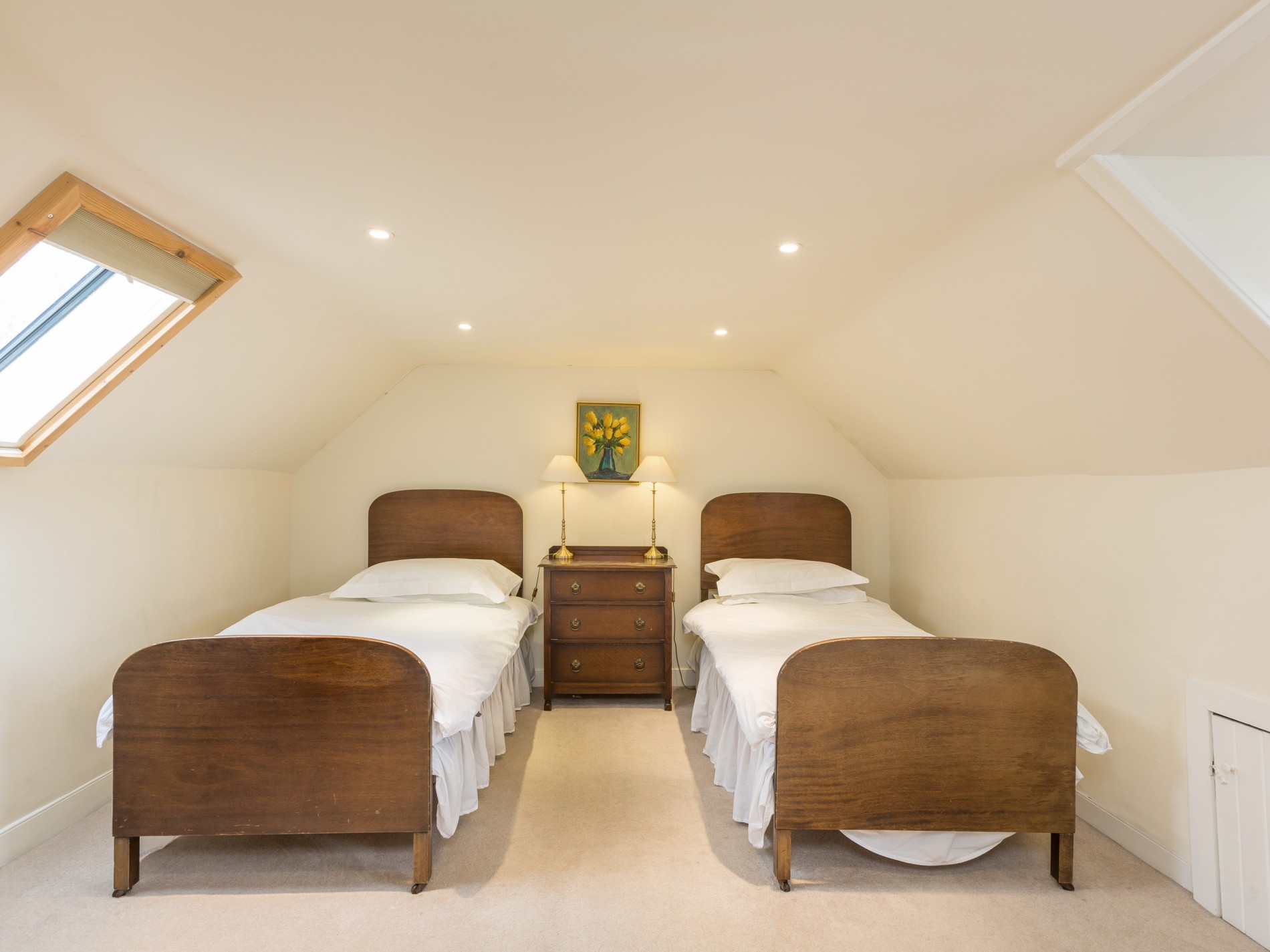 Bedroom with two single beds and bedside table