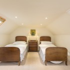 Bedroom with two single beds and bedside table