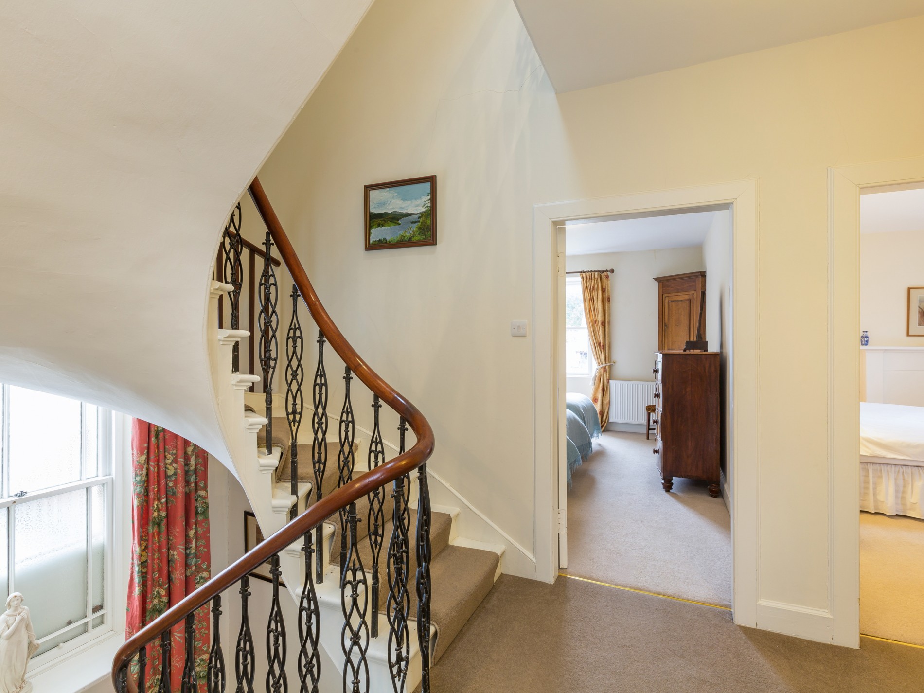 Spiral staircase looking onto bedroom