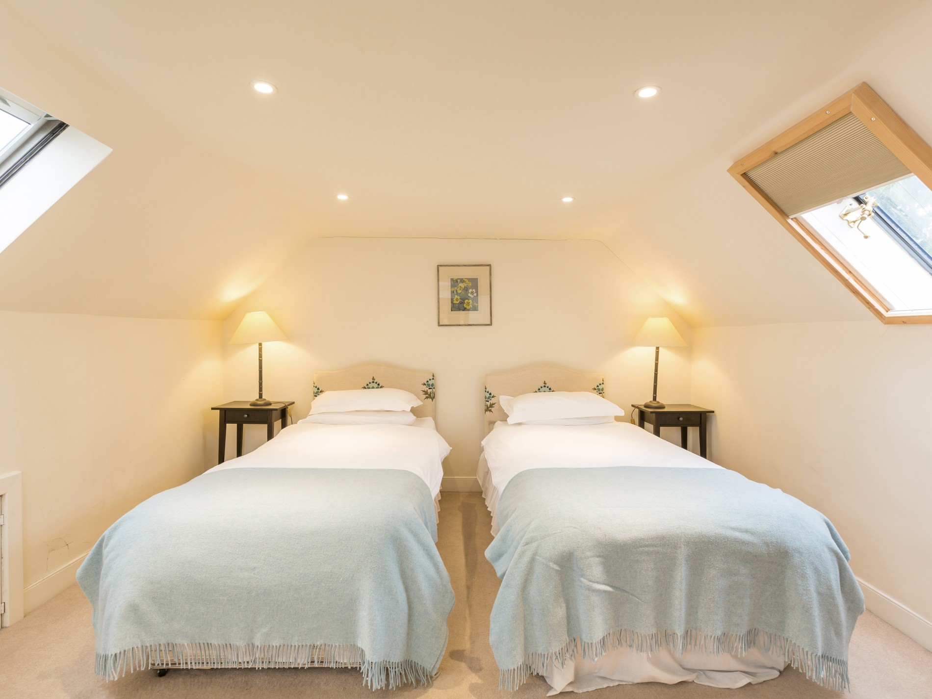 Bedroom with two single beds and bedside tables