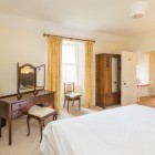 Double bedroom with wardrobe and desk with mirror