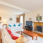 Living room with two sofas, TV and fireplace